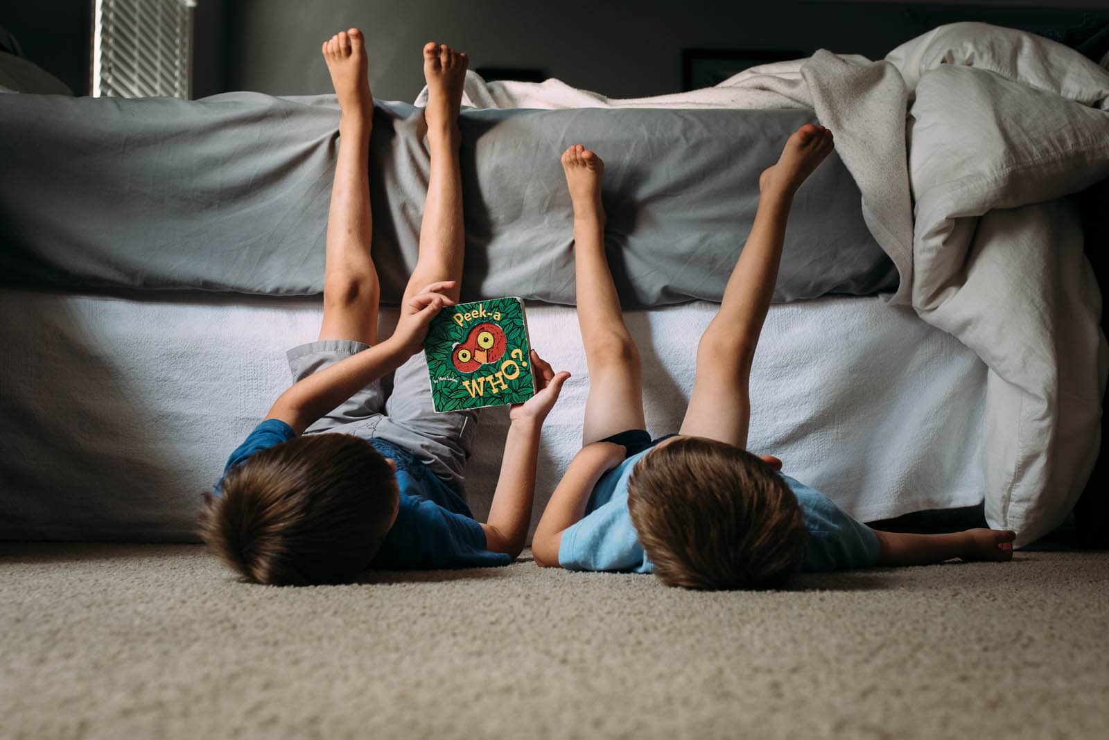 photo of two kids reading a board book by Susan Grimes