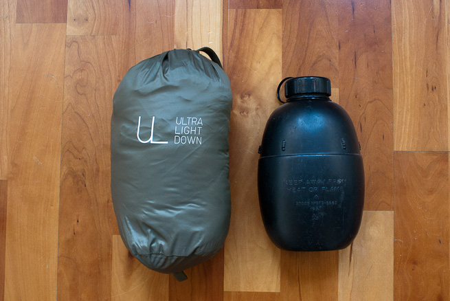 Stuffed UNIQLO Ultra Light Down gilet and waterbottle for size comparison.